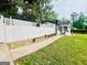 Exterior view showcasing a charming home and white fence, set amidst a serene landscape at 2502 Barge Sw Rd, Atlanta, GA 30331