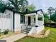 Charming home with a covered porch, featuring stone landscaping, fresh paint and a well-manicured lawn at 2502 Barge Sw Rd, Atlanta, GA 30331