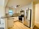 Modern kitchen featuring stainless steel appliances, granite counters, and ample cabinet space at 2502 Barge Sw Rd, Atlanta, GA 30331