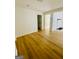 Open-concept living room with beautiful wood floors at 2502 Barge Sw Rd, Atlanta, GA 30331