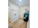 Utility room features a new water heater, and laminate flooring at 2502 Barge Sw Rd, Atlanta, GA 30331