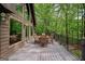 Wooden deck with outdoor furniture and wooded backyard views, perfect for gatherings at 9511 High Point Rd, Villa Rica, GA 30180