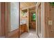 Bright bathroom with wood accents features a vanity and walk-in shower at 9511 High Point Rd, Villa Rica, GA 30180
