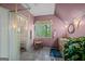 Bathroom features tiled floors, shower, window, vanity sink, and a plant at 9511 High Point Rd, Villa Rica, GA 30180