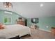 Bright bedroom with a comfortable bed, dresser, and a large window overlooking the outdoors at 9511 High Point Rd, Villa Rica, GA 30180