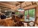 Light-filled dining room boasts hardwood floors, deck access, and open layout to the living area at 9511 High Point Rd, Villa Rica, GA 30180