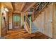Entry foyer with wooden ceiling, stairs to second floor, beautiful wood door and wood flooring at 9511 High Point Rd, Villa Rica, GA 30180