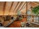 Comfortable living area with wood ceiling, hardwood floors, furniture, and decor at 9511 High Point Rd, Villa Rica, GA 30180