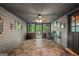 Charming sunroom with tile floors, ample windows, and access to the outdoor living area at 9511 High Point Rd, Villa Rica, GA 30180