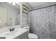 Bathroom featuring a single sink vanity, decorative shower curtain, and decorative painting at 40 Green Leaf Cir, Hampton, GA 30228