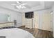Bedroom featuring a ceiling fan, wood flooring, and decorative dressers for storage at 40 Green Leaf Cir, Hampton, GA 30228