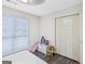 Cozy bedroom featuring a window and a spacious closet at 40 Green Leaf Cir, Hampton, GA 30228