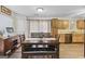 Bright dining area with a wooden table, bench seating, and a view into the adjacent kitchen at 40 Green Leaf Cir, Hampton, GA 30228