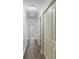 Hallway featuring wood flooring and white doors at 40 Green Leaf Cir, Hampton, GA 30228