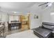 Inviting living room flows to dining area and kitchen featuring stainless steel appliances and modern countertops at 40 Green Leaf Cir, Hampton, GA 30228