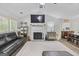 Spacious living room with vaulted ceiling, fireplace, and open layout at 40 Green Leaf Cir, Hampton, GA 30228