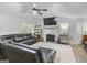 Bright living room featuring a fireplace, large TV, and comfortable seating at 40 Green Leaf Cir, Hampton, GA 30228