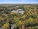 An aerial view showcases the property's proximity to local schools among a backdrop of lush trees at 1153 Dawn View Nw Ln, Atlanta, GA 30327