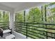 A lovely balcony featuring metal railings and serene wooded views provides a tranquil outdoor space at 1153 Dawn View Nw Ln, Atlanta, GA 30327