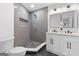Elegant bathroom featuring a tiled walk-in shower, double vanity, and modern fixtures at 1153 Dawn View Nw Ln, Atlanta, GA 30327