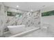 Bathroom with a soaking tub, walk-in shower, and marble-tiled walls at 1153 Dawn View Nw Ln, Atlanta, GA 30327