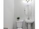 Half bathroom featuring pedestal sink, and toilet at 1153 Dawn View Nw Ln, Atlanta, GA 30327