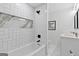Bathroom with herringbone pattern shower and white vanity with double sinks at 1153 Dawn View Nw Ln, Atlanta, GA 30327
