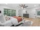 Bedroom with view to a balcony, ceiling fan, grey dresser and wood flooring at 1153 Dawn View Nw Ln, Atlanta, GA 30327