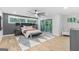 Bright bedroom with a ceiling fan, sliding glass door to the balcony, and a patterned rug at 1153 Dawn View Nw Ln, Atlanta, GA 30327
