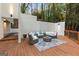 Stylish patio lounge featuring comfortable seating, an area rug and recessed lighting for cozy outdoor living at 1153 Dawn View Nw Ln, Atlanta, GA 30327