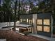Modern home with gray siding, stylish lighting, balcony, and large windows offering abundant natural light at 1153 Dawn View Nw Ln, Atlanta, GA 30327