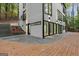 Contemporary home showcasing expansive windows, a private deck, and an inviting outdoor living space at 1153 Dawn View Nw Ln, Atlanta, GA 30327