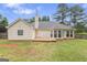 View of the back of the house and backyard at 308 Dylan Way, Mcdonough, GA 30252