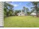 Backyard featuring a large lawn and a fence at 308 Dylan Way, Mcdonough, GA 30252