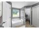 Bathroom featuring a large soaking tub and a walk in closet at 308 Dylan Way, Mcdonough, GA 30252