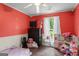 Bedroom with hardwood floors and view of window at 308 Dylan Way, Mcdonough, GA 30252