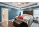 Bedroom with tray ceilings, a ceiling fan, and an attached ensuite bathroom at 308 Dylan Way, Mcdonough, GA 30252