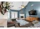 Inviting living room with vaulted ceilings, fireplace, ceiling fan, and cozy seating area at 308 Dylan Way, Mcdonough, GA 30252