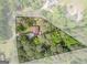 Aerial view of the property showcasing its wooded surroundings and outlining the property at 6537 Walker Rd, Riverdale, GA 30296