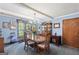 Cozy dining room with chandelier lighting, a large table, and wood floors at 6537 Walker Rd, Riverdale, GA 30296