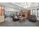 Relax in this living room, featuring a brick fireplace and comfortable seating at 6537 Walker Rd, Riverdale, GA 30296