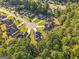 Aerial view of a neighborhood featuring well-maintained homes, lush landscaping, and a serene cul-de-sac at 440 Homeplace Dr, Stockbridge, GA 30281