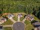 Aerial view of a cul-de-sac featuring well-maintained homes with manicured lawns and mature trees at 440 Homeplace Dr, Stockbridge, GA 30281