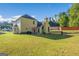 Large backyard with patio seating, perfect for outdoor dining and entertaining at 440 Homeplace Dr, Stockbridge, GA 30281