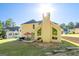 Backyard featuring a patio with outdoor seating, grill, and views of lush green grass and surrounding trees at 440 Homeplace Dr, Stockbridge, GA 30281