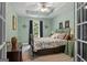 Bedroom with tray ceiling, decorative wall hangings, dark curtains and neutral carpet at 440 Homeplace Dr, Stockbridge, GA 30281
