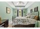 Bright bedroom with tray ceilings, neutral carpet and decorative wall hangings at 440 Homeplace Dr, Stockbridge, GA 30281
