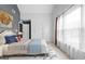 Bright, spacious bedroom with soft carpet, large window, and tasteful decor at 440 Homeplace Dr, Stockbridge, GA 30281