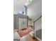 Bright foyer with high ceilings, large window, hardwood floors, and staircase at 440 Homeplace Dr, Stockbridge, GA 30281