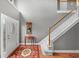 Entryway featuring a staircase, light gray walls, and decorative rug at 440 Homeplace Dr, Stockbridge, GA 30281